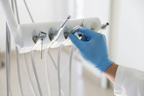 Professional Tooth Extraction technician working in East Patchogue, NY